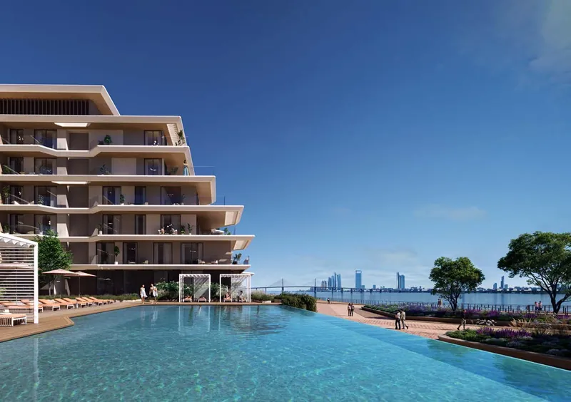 Bashayer Residences, with the infinity pool and the city skyline beyond